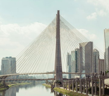 gray concrete bridge over river